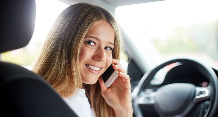 Business woman calling in car